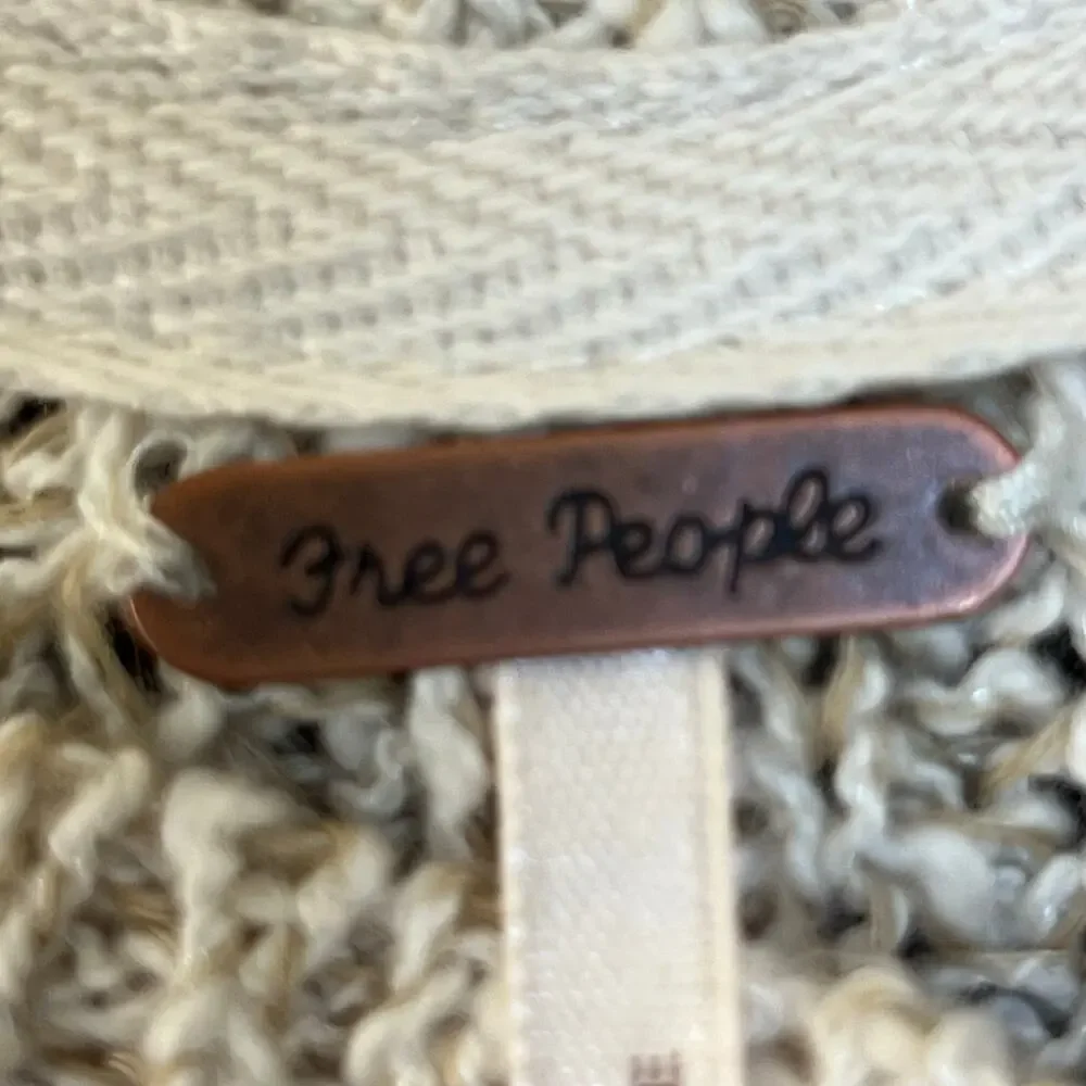 Free People. Women’s bouclé long sleeve cotton sweater
